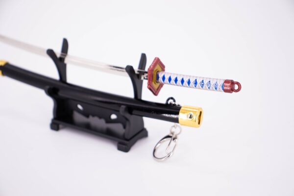 DEMON SLAYER – GIYU TOMIOKA’S NICHIRIN SWORD KEYCHAIN - Image 2