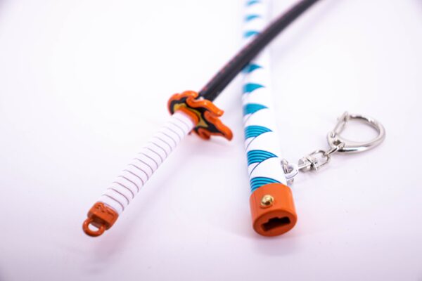 DEMON SLAYER – KYOJURO RENGOKU’S NICHIRIN SWORD KEYCHAIN - Image 5